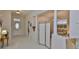 Bright entryway with tile floors, decorative pillars and ample space at 2128 Worthington Greens Dr, Sun City Center, FL 33573