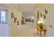 Bright open-concept living area with tile floors, pillars, and neutral decor creating a welcoming space at 2128 Worthington Greens Dr, Sun City Center, FL 33573
