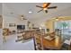 Open-concept living area with tile floors, seamlessly connecting to the dining area at 2128 Worthington Greens Dr, Sun City Center, FL 33573