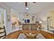 Open floor plan with tiled floors that connects the living, dining and kitchen areas at 2128 Worthington Greens Dr, Sun City Center, FL 33573