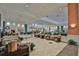 Inviting lobby area with comfortable seating, elegant decor, and abundant natural light at 2128 Worthington Greens Dr, Sun City Center, FL 33573