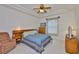 Bedroom with trey ceilings, a window, and wooden furniture at 2128 Worthington Greens Dr, Sun City Center, FL 33573