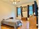 Comfortable bedroom featuring a ceiling fan, natural light, and minimalist decor with wooden accents for a cozy atmosphere at 2130 Broadway View Ave, Brandon, FL 33510