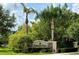 Sign for the townhomes at Broadway Centre surrounded by lush landscaping and palm trees in a well-kept community at 2130 Broadway View Ave, Brandon, FL 33510