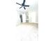 Spacious bedroom with neutral paint, carpet flooring, and a ceiling fan at 2302 Maki Rd # 69, Plant City, FL 33563