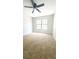 Bedroom featuring carpeting and a large window at 2302 Maki Rd # 69, Plant City, FL 33563