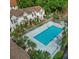 An overhead shot displaying a community pool surrounded by palm trees at 2302 Maki Rd # 69, Plant City, FL 33563