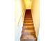 Carpeted stairway with a handrail, illuminated by light at 2302 Maki Rd # 69, Plant City, FL 33563