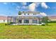 The backyard features a screened pool area, lush green grass and is great for relaxing at 2424 Caraway Dr, Venice, FL 34292