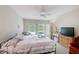 Bedroom view showcasing the bed, backyard pool view, and patio access at 2424 Caraway Dr, Venice, FL 34292