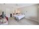 Neutral-toned bedroom featuring ample space, closet, and a calm, inviting atmosphere at 2424 Caraway Dr, Venice, FL 34292