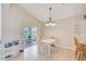 Cozy dining area with sliding doors to the outdoors and chandelier at 2424 Caraway Dr, Venice, FL 34292