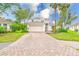 Two-story home features a driveway and manicured lawn at 2424 Caraway Dr, Venice, FL 34292