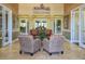 Inviting lobby with a comfortable seating area at Stoneybrook at Venice community center at 2424 Caraway Dr, Venice, FL 34292