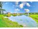 View of the pond behind the houses at 2424 Caraway Dr, Venice, FL 34292