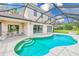 Relax in a pristine pool with an outdoor dining area at 2424 Caraway Dr, Venice, FL 34292