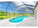 The refreshing pool offers a view of the picturesque pond at 2424 Caraway Dr, Venice, FL 34292