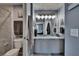 Bathroom with granite vanity, updated fixtures, framed mirror, and view into the ensuite bedroom at 2435 Edgewater Falls Dr, Brandon, FL 33511