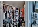 Walk-in closet featuring custom shelving, clothing racks, and shoe storage at 2435 Edgewater Falls Dr, Brandon, FL 33511
