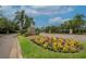 Edgewater at Lake Brandon community entrance with colorful flowers and manicured landscaping at 2435 Edgewater Falls Dr, Brandon, FL 33511