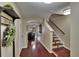 Inviting foyer featuring hardwood floors, staircase, and elegant decor at 2435 Edgewater Falls Dr, Brandon, FL 33511