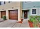 Inviting front entrance with a single-car garage, well-maintained lawn, and walkway at 2435 Edgewater Falls Dr, Brandon, FL 33511