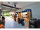 Organized garage space featuring a workbench, storage cabinets, and ample room for projects at 2435 Edgewater Falls Dr, Brandon, FL 33511