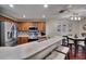 Well-lit kitchen features stainless steel appliances, modern backsplash and extended countertop seating at 2435 Edgewater Falls Dr, Brandon, FL 33511