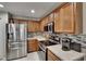 Kitchen featuring stainless steel appliances, backsplash, and ample cabinet storage at 2435 Edgewater Falls Dr, Brandon, FL 33511