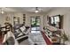 Living room boasts contemporary furnishings, a sliding glass door, and an entertainment center at 2435 Edgewater Falls Dr, Brandon, FL 33511