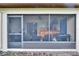 View of the screened-in porch with an outdoor bar, seating area, and BBQ grill at 2435 Edgewater Falls Dr, Brandon, FL 33511