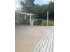 Backyard patio area with a picnic table, BBQ grill, and partially covered patio space at 2444 35Th N St, St Petersburg, FL 33713
