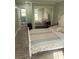 Well-lit bedroom with wood floors, a closet, and a comfortable bed at 2444 35Th N St, St Petersburg, FL 33713