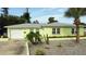 Charming single-story home with a well-maintained lawn and lovely landscaping and a one car garage at 2444 35Th N St, St Petersburg, FL 33713