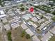 Aerial view of a condo community with ample covered parking and mature trees at 24862 Us Highway 19 N # 1105, Clearwater, FL 33763