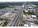 Aerial view of an expressway bisecting a city near a water park and condos at 24862 Us Highway 19 N # 1105, Clearwater, FL 33763
