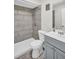 Well-lit bathroom featuring a modern sink, toilet, and shower with stylish tile at 24862 Us Highway 19 N # 1105, Clearwater, FL 33763