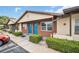 Charming exterior showing colorful doors, brickwork, and well-maintained landscaping at 24862 Us Highway 19 N # 1105, Clearwater, FL 33763