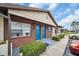 Charming exterior showing colorful doors, brickwork, and well-maintained landscaping, with parking at 24862 Us Highway 19 N # 1105, Clearwater, FL 33763
