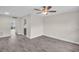 Bright living room featuring modern flooring, ceiling fan and neutral paint palette at 24862 Us Highway 19 N # 1105, Clearwater, FL 33763