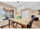 Dining room boasting pendant lights, a marble table and stylish black chairs at 2608 Camille Dr, Palm Harbor, FL 34684