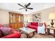 Inviting living room with stylish furniture, ceiling fan, and wood-look flooring at 2608 Camille Dr, Palm Harbor, FL 34684