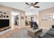 Open-concept living room with neutral walls, wood-look floors, and lots of natural light at 2608 Camille Dr, Palm Harbor, FL 34684