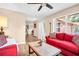 Bright and airy living room featuring wood-look floors and neutral decor at 2608 Camille Dr, Palm Harbor, FL 34684