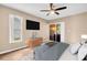 Comfortable bedroom with ceiling fan, sliding glass doors, and modern furniture at 2608 Camille Dr, Palm Harbor, FL 34684