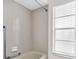 This tiled shower stall features a shower head, and an adjustable shower handle at 2608 Camille Dr, Palm Harbor, FL 34684