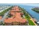 Stunning aerial view of waterfront condos with boat docks along canal and beautiful ocean views at 2741 Via Cipriani # 934B, Clearwater, FL 33764