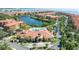 Aerial shot of the community pool, amenity center, and surrounding neighborhood at 2741 Via Cipriani # 934B, Clearwater, FL 33764