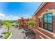 Exterior view of condo buildings with palm trees, parking areas, and lush landscaping at 2741 Via Cipriani # 934B, Clearwater, FL 33764