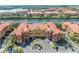 View of condo buildings with garages and nearby guest parking spots at 2741 Via Cipriani # 934B, Clearwater, FL 33764